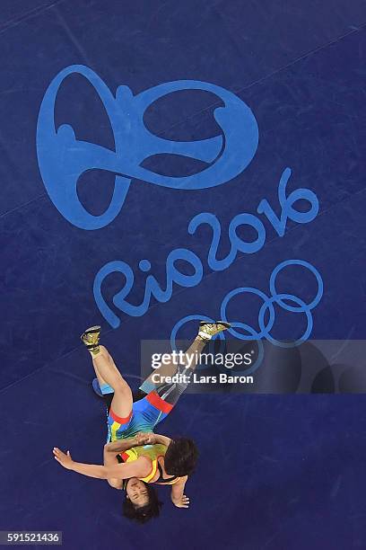 Yanan Sun of China competes against Zhuldyz Eshimova of Kazakhstan during a Women's Freestyle 48kg Bronze Medal bout on Day 12 of the Rio 2016...