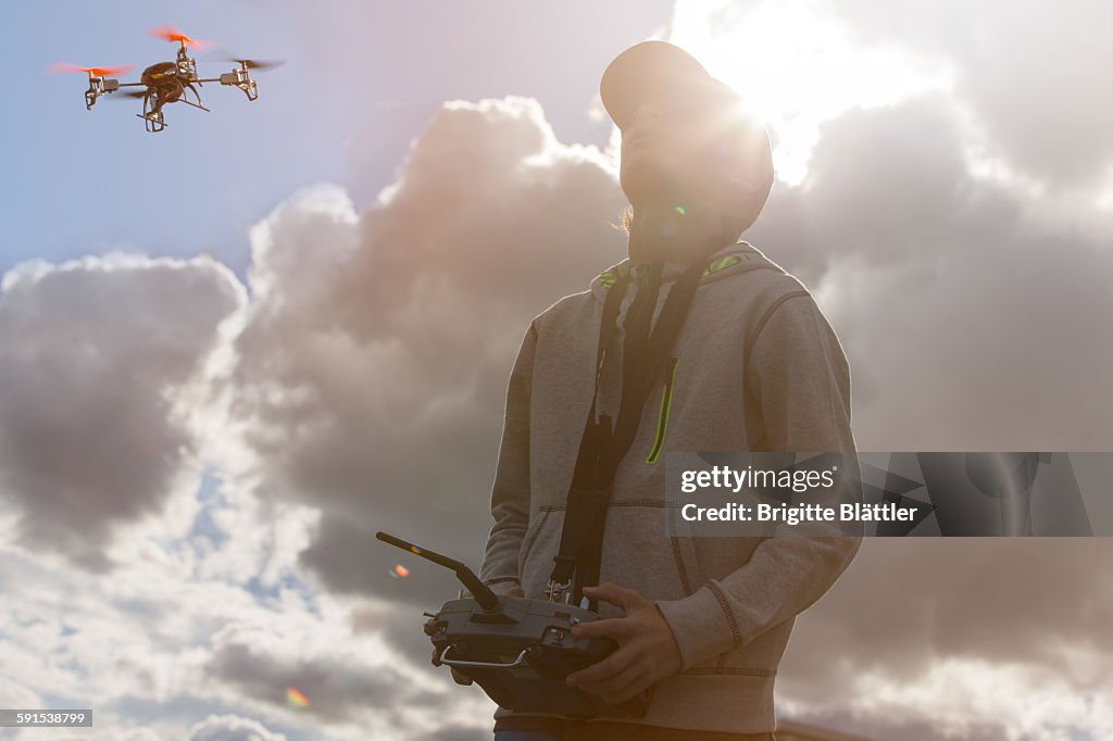 Boy flying drone in Switzerland