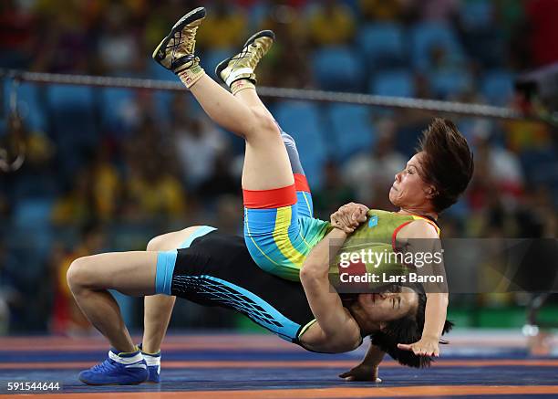 Yanan Sun of China competes against Zhuldyz Eshimova of Kazakhstan during a Women's Freestyle 48kg Bronze Medal bout on Day 12 of the Rio 2016...