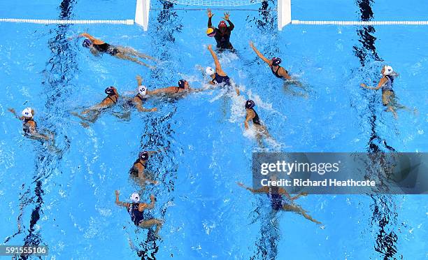 Goalkeeper Ashleigh Johnson makes a save during the Women's Water Polo quarter final match between Hungary and USA at Olympic Aquatics Stadium on...