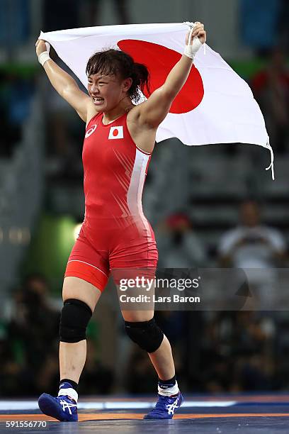 Eri Tosaka of Japan celebrates winning gold against Mariya Stadnik of Azerbaijan in the Women's Freestyle 48kg event on Day 12 of the Rio 2016...