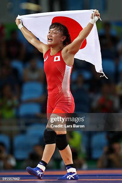 Eri Tosaka of Japan celebrates winning gold against Mariya Stadnik of Azerbaijan in the Women's Freestyle 48kg event on Day 12 of the Rio 2016...