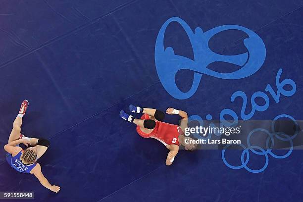Eri Tosaka of Japan celebrates winning gold against Mariya Stadnik of Azerbaijan in the Women's Freestyle 48kg event on Day 12 of the Rio 2016...