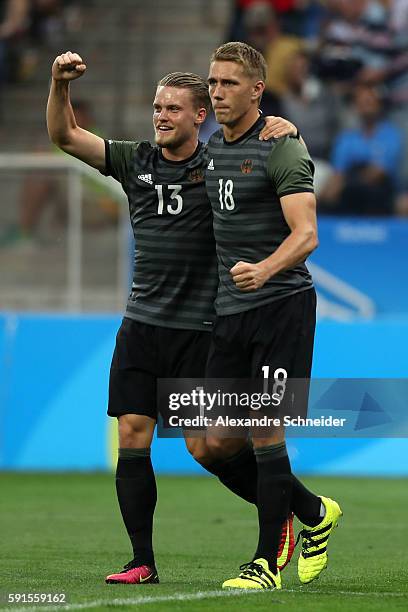 Nils Petersen of Germany celebrates scoring a goal with team mate Philipp Max of Germany during the Men's Semifinal Football match between Nigeria...