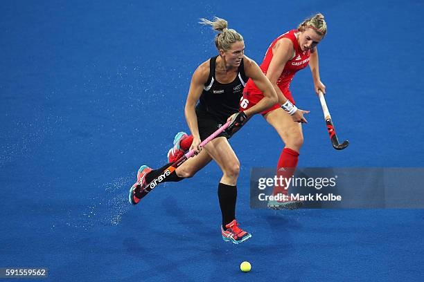 Gemma Flynn of New Zealand and Laura Unsworth of Great Britain compete for the ball during the womens semifinal match between the Great Britain and...