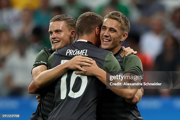 Nils Petersen of Germany celebrates scoring a goal with team mates Philipp Max and Grischa Proemel of Germany during the Men's Semifinal Football...