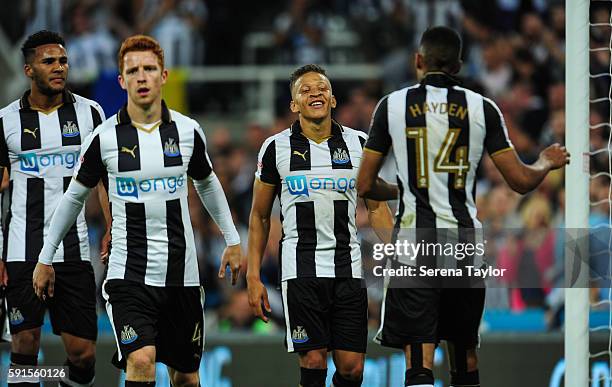 Dwight Gale of Newcastle United looks to celebrate with Isaac Hayden after scoring Newcastle's fourth goal from a free kick during the Sky Bet...