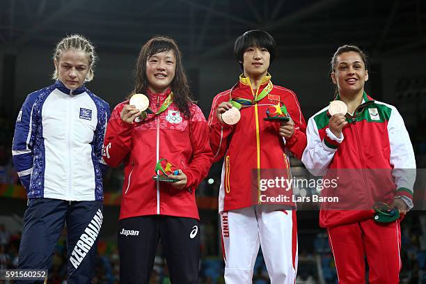 Silver medalist Mariya Stadnik of Azerbaijan, gold medalist Eri Tosaka of Japan, bronze medalist Yanan Sun of China and bronze medalist Elitsa...