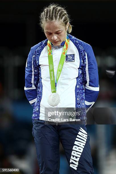 Silver medalist Mariya Stadnik of Azerbaijan stands on the podium during the medal ceremony for the Women's Freestyle 48kg event on Day 12 of the Rio...