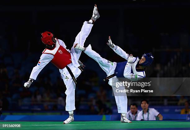 Luisito Pie of the Dominican Republic competes against Tawin Hanprab of Thailand during the Taekwondo Men's -58kg Semi Final contest at Cairoca Arena...