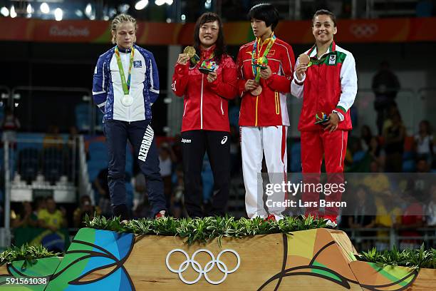 Silver medalist Mariya Stadnik of Azerbaijan, gold medalist Eri Tosaka of Japan, bronze medalist Yanan Sun of China and bronze medalist Elitsa...