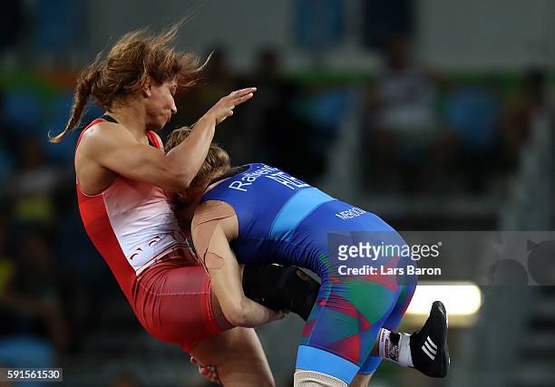Marwa Amri of Tunisia competes against Yuliya Ratkevich of Azerbaijan during the Womem's Freestyle 58 kg Bronze match on Day 12 of the Rio 2016...