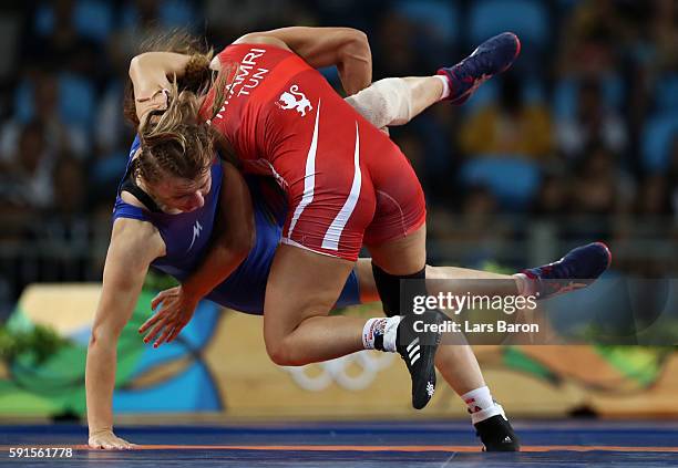 Marwa Amri of Tunisia competes against Yuliya Ratkevich of Azerbaijan during the Women's Freestyle 58 kg Bronze match on Day 12 of the Rio 2016...