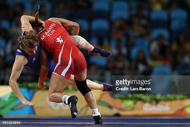 Marwa Amri of Tunisia competes against Yuliya Ratkevich of Azerbaijan during the Women's Freestyle 58 kg Bronze match on Day 12 of the Rio 2016...