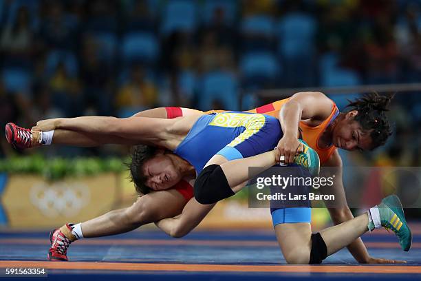 Sakshi Malik of India competes against Aisuluu Tynybekova of Kyrgyzstan during the Women's Freestyle 58 kg Bronze match on Day 12 of the Rio 2016...