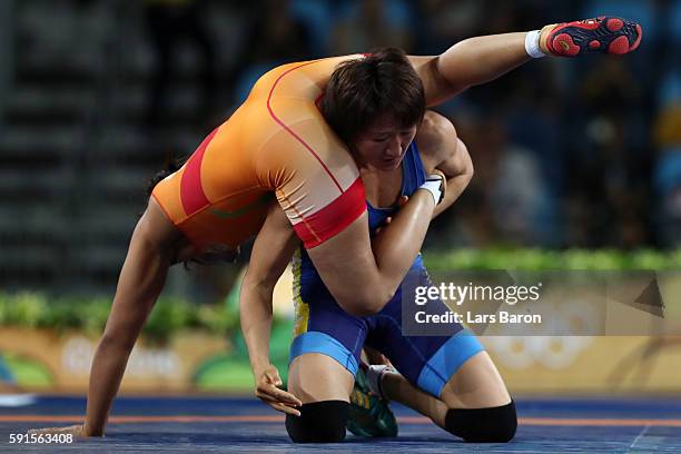 Sakshi Malik of India competes against Aisuluu Tynybekova of Kyrgyzstan during the Women's Freestyle 58 kg Bronze match on Day 12 of the Rio 2016...