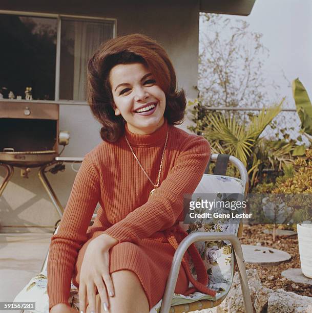 Portrait of American actress Annette Funicello as she sits outdoors, 1965.