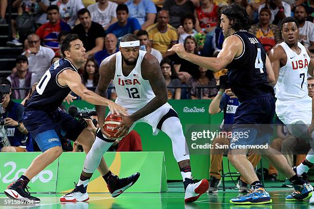 Demarcus Cousins of United States with the ball against Carlos Delfino of Argentina during the Men's Quarterfinal match on Day 12 of the Rio 2016...