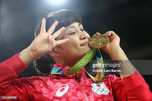 Gold medalist Kaori Icho of Japan celebrates during the medal ceremony after the Women's Freestyle 58 kg competition on Day 12 of the Rio 2016...