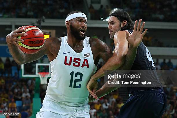 Demarcus Cousins of United States with the ball against Carlos Delfino of Argentina during the Men's Quarterfinal match on Day 12 of the Rio 2016...