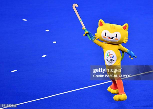 Vinicius, the mascot of the Olympic games, holds a stick on the pitch during the women's semifinal field hockey New Zealand vs Britain match of the...