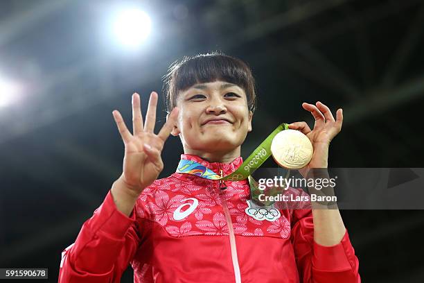 Gold Medalist Kaori Icho of Japan celebrates during the medal ceremony after the Women's Freestyle 58 kg competition on Day 12 of the Rio 2016...