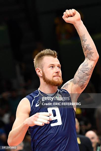 Italy's Ivan Zaytsev celebrates after winning the men's quarter-final volleyball match against Iran at Maracanazinho Stadium in Rio de Janeiro on...