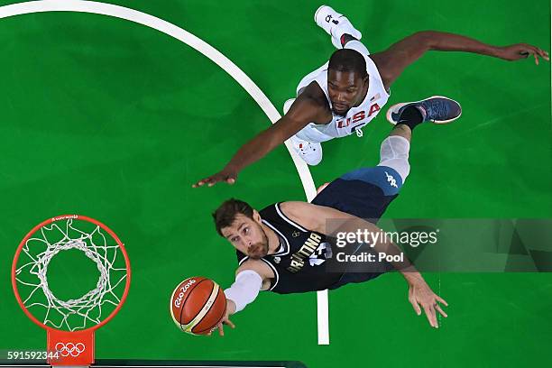 Andres Nocioni of Argentina goes up for the ball ahead of Kevin Durant of United States during the Men's Quarterfinal match on Day 12 of the Rio 2016...