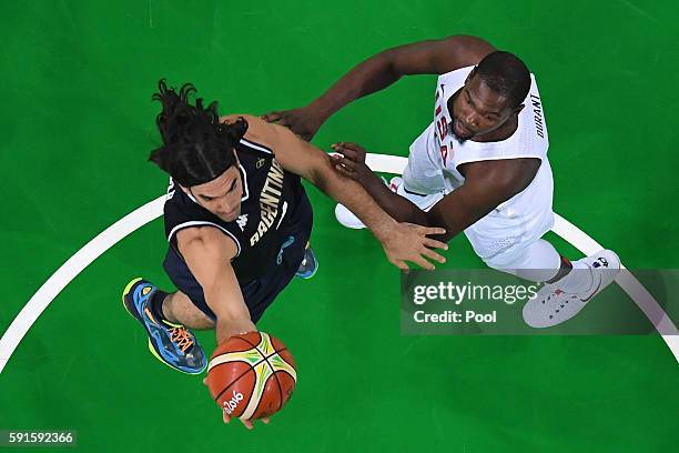 Andres Nocioni of Argentina goes up for the ball ahead of Kevin Durant of United States during the Men's Quarterfinal match on Day 12 of the Rio 2016...