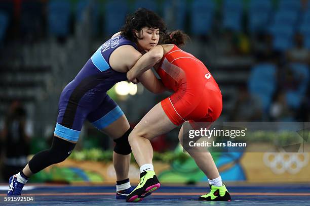 Sara Dosho of Japan competes against Natalia Vorobeva of Russia during the Women's Freestyle 69 kg Gold Medal match on Day 12 of the Rio 2016 Olympic...