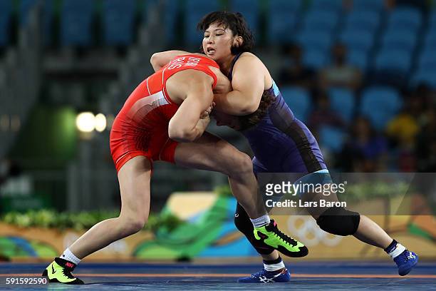 Natalia Vorobeva of Russia competes against Sara Dosho of Japan during the Women's Freestyle 69kg Gold Medal bout on Day 12 of the Rio 2016 Olympic...