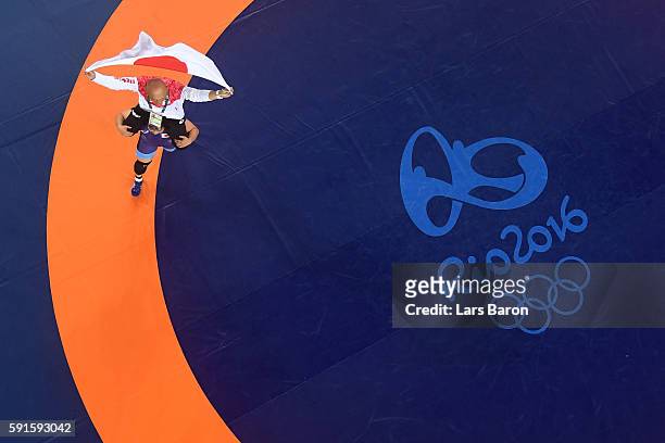 Sara Dosho of Japan celebrates after defeating Natalia Vorobeva of Russia in the Women's Freestyle 69 kg Gold Medal match on Day 12 of the Rio 2016...