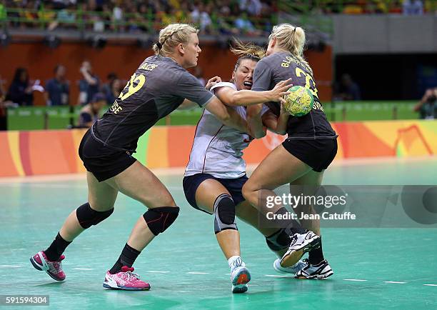 Nora Mork of Norway, Jenny Alm and Hanna Blomstrand of Sweden in action during the handball match between Norway and Sweden in the Women's...