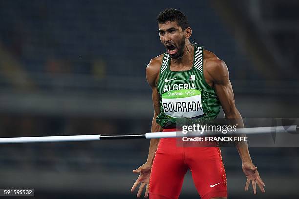 Algeria's Larbi Bourrada reacts as he competes in the Men's Decathlon High Jump during the athletics event at the Rio 2016 Olympic Games at the...