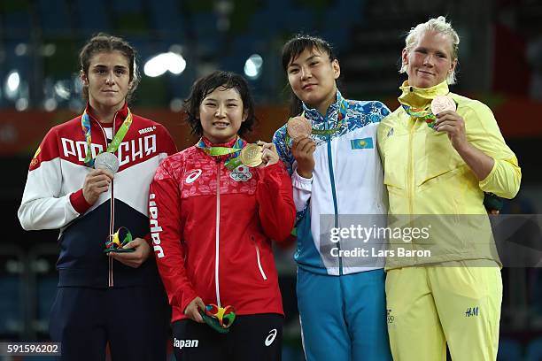 Silver medalist Natalia Vorobeva of Russia, gold medalist Sara Dosho of Japan, bronze medalist Elmira Syzdykova of Kazakhstan and bronze medalist...