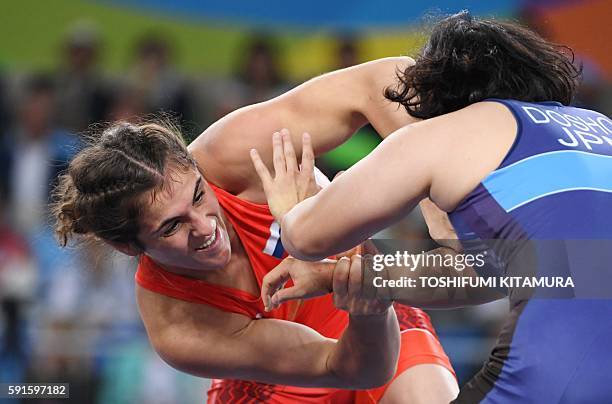 Japan's Sara Dosho wrestles with Russia's Natalia Vorobeva in their women's 69kg freestyle final match on August 17 during the wrestling event of the...