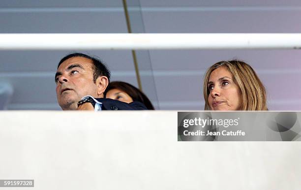 Of Renault and Nissan Carlos Ghosn and his wife Carole Ghosn attend the athletics competition on day 11 of the Rio 2016 Olympic Games at Olympic...