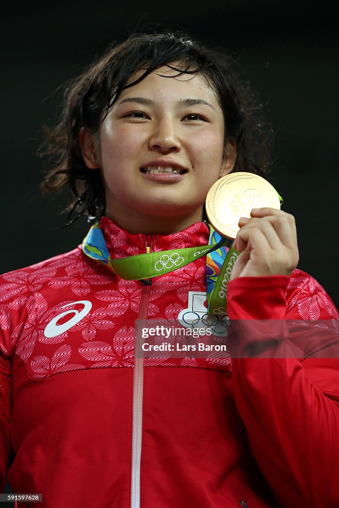 Gold medalist Sara Dosho of Japan stands on the podium during the