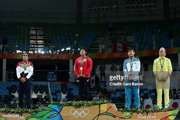 Silver medalist Natalia Vorobeva of Russia, gold medalist Sara Dosho of Japan, bronze medalist Elmira Syzdykova of Kazakhstan and bronze medalist...