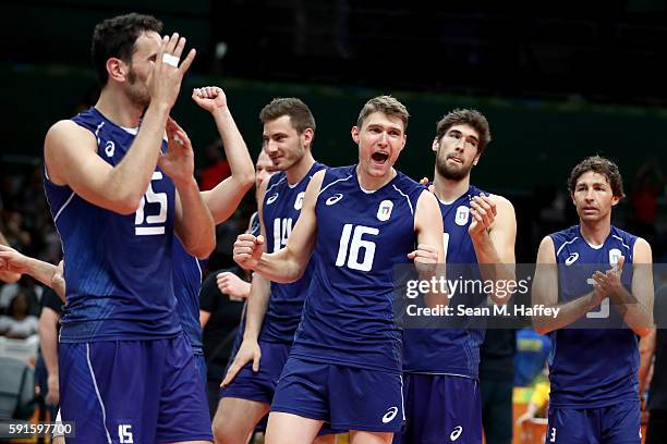 Emanuele Birarelli, Pasquale Sottile, Oleg Antonov, and Matteo Piano of Italy react against Iran during the Men's Quarterfinal Volleyball match on...