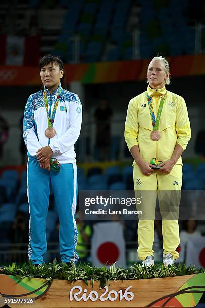 Bronze medalist Elmira Syzdykova of Kazakhstan and bronze medalist Anna Jenny Fransson of Sweden stand on the podium during the medal ceremony for...