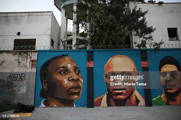 New mural of street art honoring the first Olympic refugee team is displayed during the Rio 2016 Olympic Games on August 17, 2016 in Rio de Janeiro,...