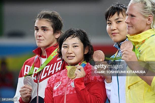 Russia's silver medallist Natalia Vorobeva, Japan's gold medallist Sara Dosho, Kazakhstan's bronze medallist Elmira Syzdykova and Sweden's Anna Jenny...