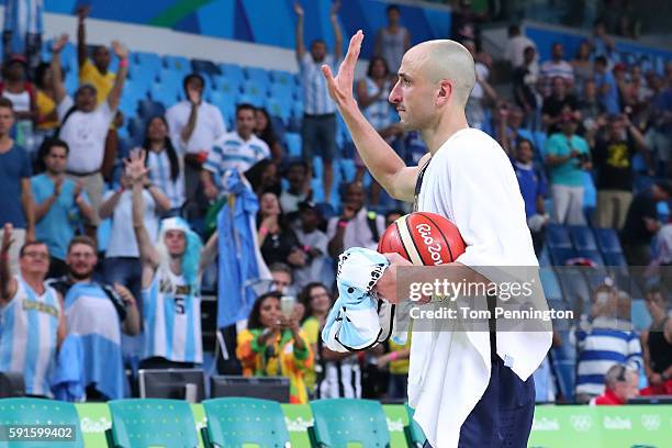 Manu Ginobili of Argentina waves to the fans after losing to the United States during the Men's Basketball Quarterfinal game at Carioca Arena 1 on...