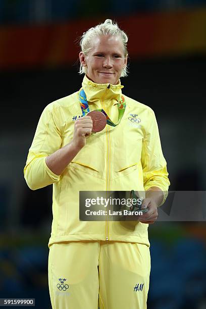 Bronze medalist Anna Jenny Fransson of Sweden stands on the podium during the medal ceremony for the Women's Freestyle 69kg event on Day 12 of the...