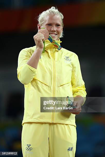 Bronze medalist Anna Jenny Fransson of Sweden stands on the podium during the medal ceremony for the Women's Freestyle 69kg event on Day 12 of the...