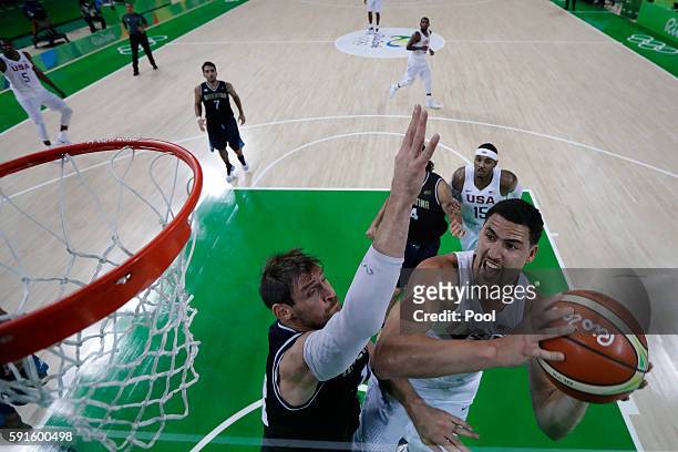 Klay Thompson of United States goes up for a shot against Andres Nocioni of Argentina during the Men's Quarterfinal match on Day 12 of the Rio 2016...