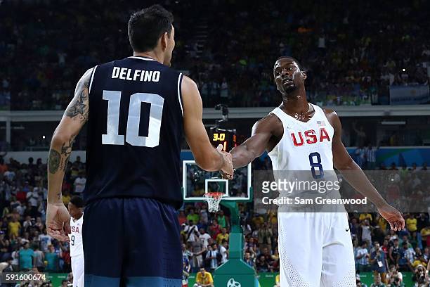 Harrison Barnes of United States shakes hands with Carlos Delfino of Argentina during the Men's Quarterfinal match on Day 12 of the Rio 2016 Olympic...