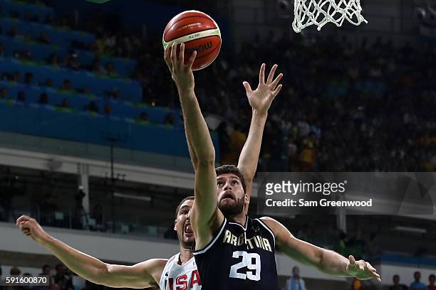 Patricio Garino of Argentina shoots the ball over Klay Thompson of United States during the Men's Quarterfinal match on Day 12 of the Rio 2016...