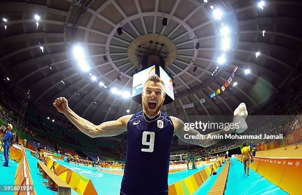Ivan Zaytsev of Italy celebrates against Iran during the Men's Quarterfinal Volleyball match on Day 12 of the Rio 2016 Olympic Games at Maracanazinho...